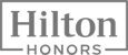 The image is a logo of "Hilton Honors," a rewards program.