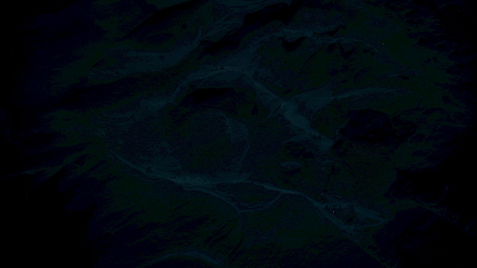 The image is very dark and hard to discern, likely an aerial or abstract view with minimal visible details.